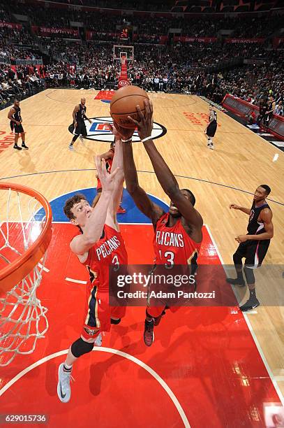 Omer Asik and Cheick Diallo of the New Orleans Pelicans go for the rebound against the LA Clippers on December 10, 2016 at STAPLES Center in Los...