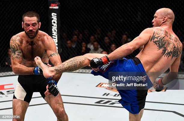 Donald Cerrone knocks out Matt Brown with a kick to the head in their welterweight bout during the UFC 206 event inside the Air Canada Centre on...