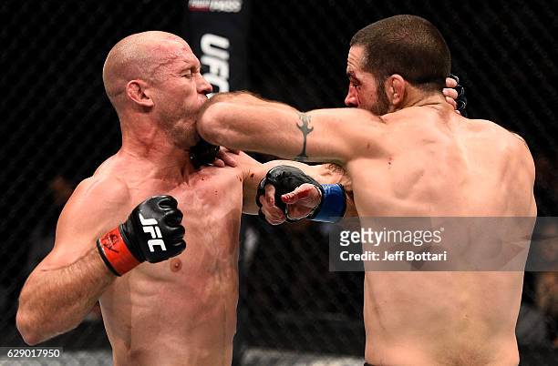 Matt Brown elbows Donald Cerrone in their welterweight bout during the UFC 206 event inside the Air Canada Centre on December 10, 2016 in Toronto,...