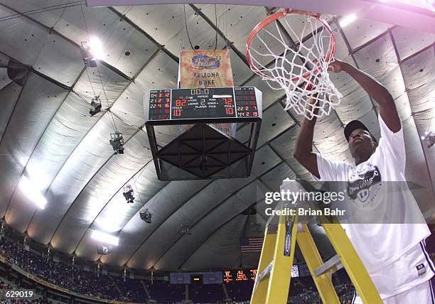 Jason Williams of Duke cuts down the net after defeating Arizona 82-72 in the NCAA National Championship Game of the Men's Final Four tournament at...