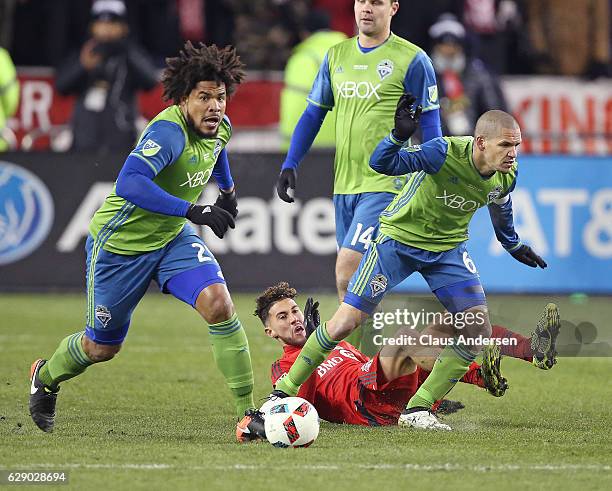 Roman Torres and Osvaldo Alonso of the Seattle Sounders break away against the Toronto FC during the 2016 MLS Cup at BMO Field on December 10, 2016...