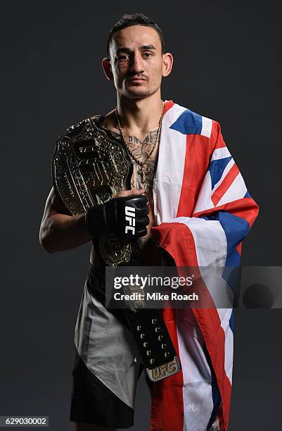 Max Holloway poses for a portrait backstage after his victory over Anthony Pettis during the UFC 206 event inside the Air Canada Centre on December...