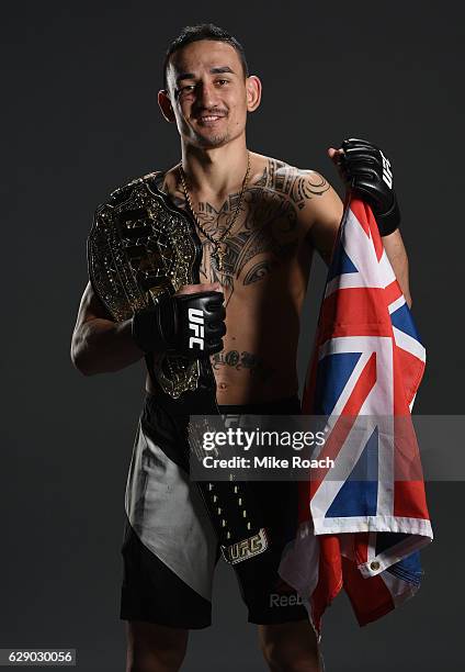 Max Holloway poses for a portrait backstage after his victory over Anthony Pettis during the UFC 206 event inside the Air Canada Centre on December...