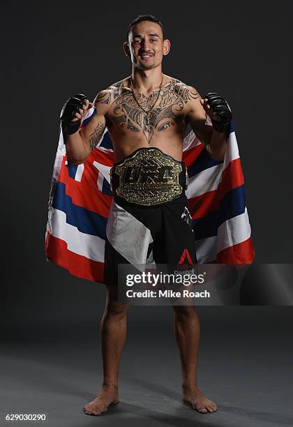 Max Holloway poses for a portrait backstage after his victory over Anthony Pettis during the UFC 206 event inside the Air Canada Centre on December...