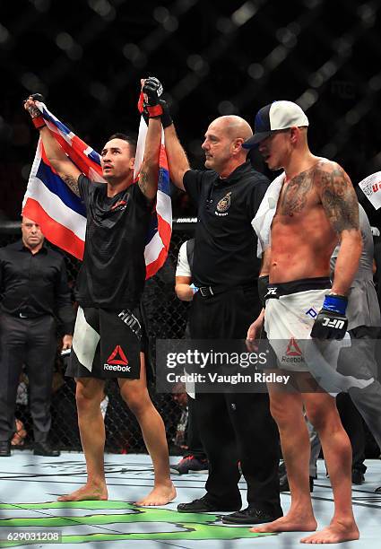 Max Holloway of the United States defeats Anthony Pettis of the United States for the Interim Featherweight Title during the UFC 206 event at Air...
