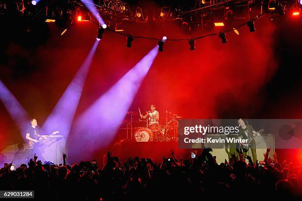 Mark Hoppus, Travis Barker and Matt Skiba of the band Blink-182 performs onstage at 106.7 KROQ Almost Acoustic Christmas 2016 - Night 1 at The Forum...