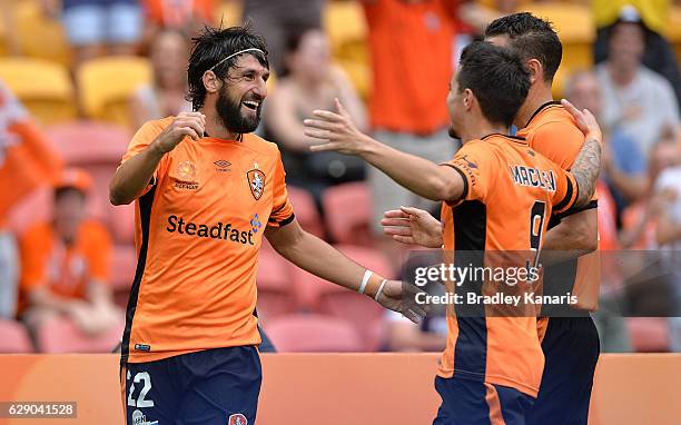 Thomas Broich of the Roar is congratulated by team mates after scoring a goal during the round 10 A-League match between the Brisbane Roar and...