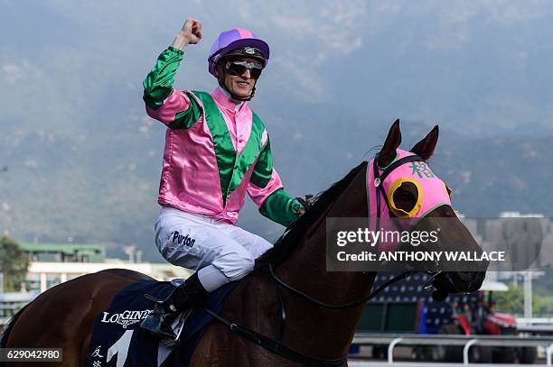 Australian jockey Zac Purton reacts after winning the 1,200m Longines Hong Kong Sprint Group One race with "Aerovelocity" during the Hong Kong...