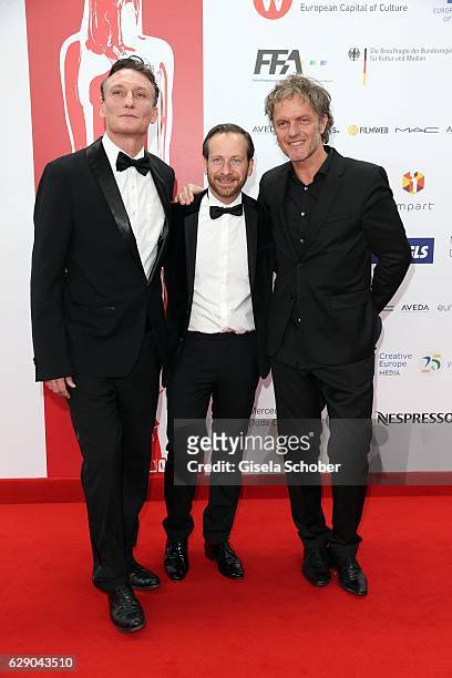 Oliver Masucci, Fabian Busch and Christoph Mueller , film, 'er ist wieder da' during the 29th European Film Awards at National Forum of Music on...