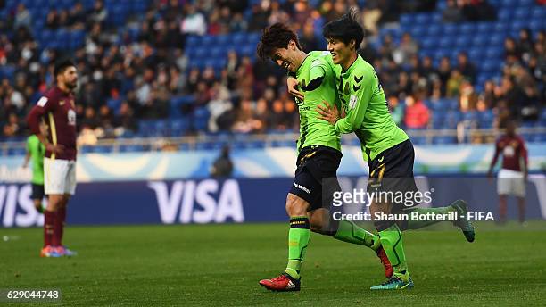 Goalscorer Kim Bokyung of Jeonbuk Hyundai celebrates after scoring the opening goal with Kim Changsoo of Jeonbuk Hyundai during the FIFA Club World...