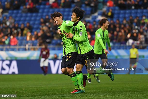 Goalscorer Kim Bokyung of Jeonbuk Hyundai celebrates after scoring the opening goal with Kim Changsoo of Jeonbuk Hyundai during the FIFA Club World...