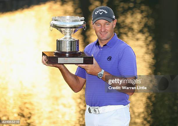 Sam Brazel of Australia poses with the trophy after winning the UBS Hong Kong Open at The Hong Kong Golf Club on December 11, 2016 in Hong Kong, Hong...