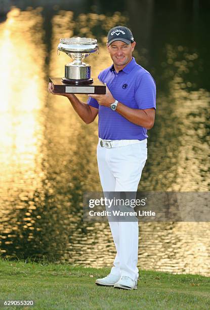 Sam Brazel of Australia poses with the trophy after winning the UBS Hong Kong Open at The Hong Kong Golf Club on December 11, 2016 in Hong Kong, Hong...