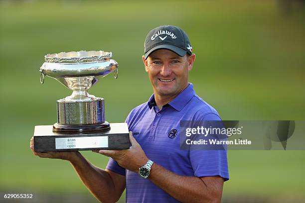 Sam Brazel of Australia poses with the trophy after winning the UBS Hong Kong Open at The Hong Kong Golf Club on December 11, 2016 in Hong Kong, Hong...