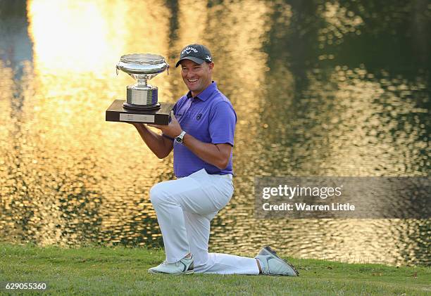 Sam Brazel of Australia poses with the trophy after winning the UBS Hong Kong Open at The Hong Kong Golf Club on December 11, 2016 in Hong Kong, Hong...