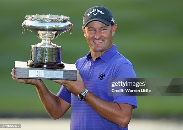 Sam Brazel of Australia poses with the trophy after winning the UBS Hong Kong Open at The Hong Kong Golf Club on December 11, 2016 in Hong Kong, Hong...