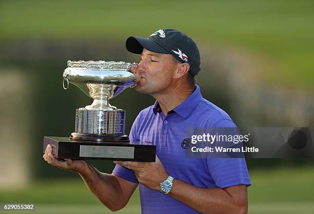 Sam Brazel of Australia poses with the trophy after winning the UBS Hong Kong Open at The Hong Kong Golf Club on December 11, 2016 in Hong Kong, Hong...