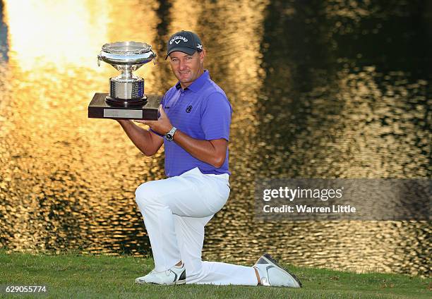 Sam Brazel of Australia poses with the trophy after winning the UBS Hong Kong Open at The Hong Kong Golf Club on December 11, 2016 in Hong Kong, Hong...