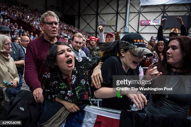 Protestor shouts at President-Elect Donald J. Trump as he speaks at a "USA Thank You Tour 2016" event at the DeltaPlex in Grand Rapids, Mi. On...