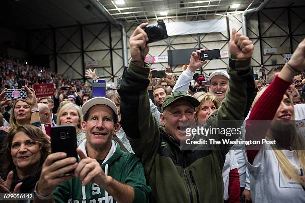 Supports cheer as President-Elect Donald J. Trump speaks at a "USA Thank You Tour 2016" event at the DeltaPlex in Grand Rapids, Mi. On Friday, Dec....