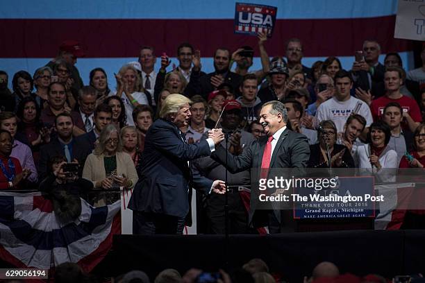 President-elect Donald Trump thanks Dow Chemical Company Chairman and Chief Executive Officer Andrew Liveris as they speak at a "USA Thank You Tour...
