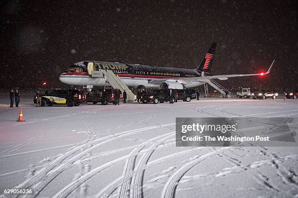 Motorcade carrying President-elect Donald Trump arrives at his plane at Gerald R. Ford International Airport in Grand Rapids, Mi. On Friday, Dec. 09,...