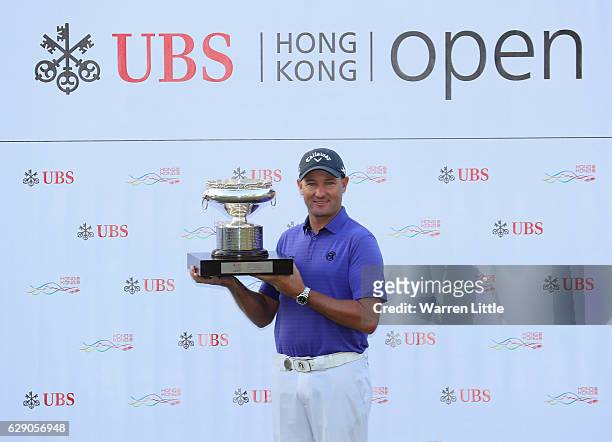 Sam Brazel of Australia poses with the trophy after winning the UBS Hong Kong Open at The Hong Kong Golf Club on December 11, 2016 in Hong Kong, Hong...