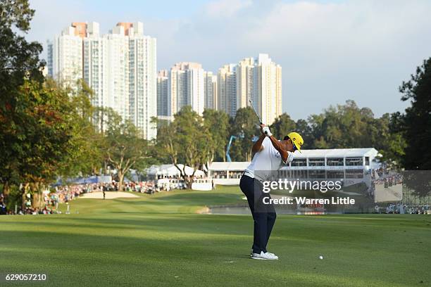 Rafa Cabrera Bello of Spain plays his second shot into the 18th green during the final round of the UBS Hong Kong Open at The Hong Kong Golf Club on...