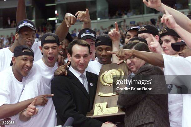 Head coach Mike Krzyzewski of Duke is awarded with the trophy after defeating Arizona 82-72 in the NCAA National Championship Game of the Men's Final...