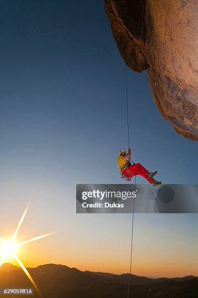 Man rappeling in the Austrian alps.