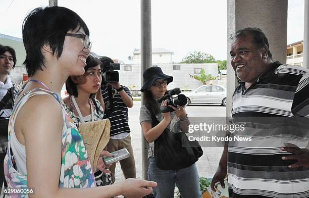 Marshall Islands - Keiko Takahashi a law student at Fukushima University, talks to Dean Langinbelik, a local assemblyman in the Marshall Islands, in...