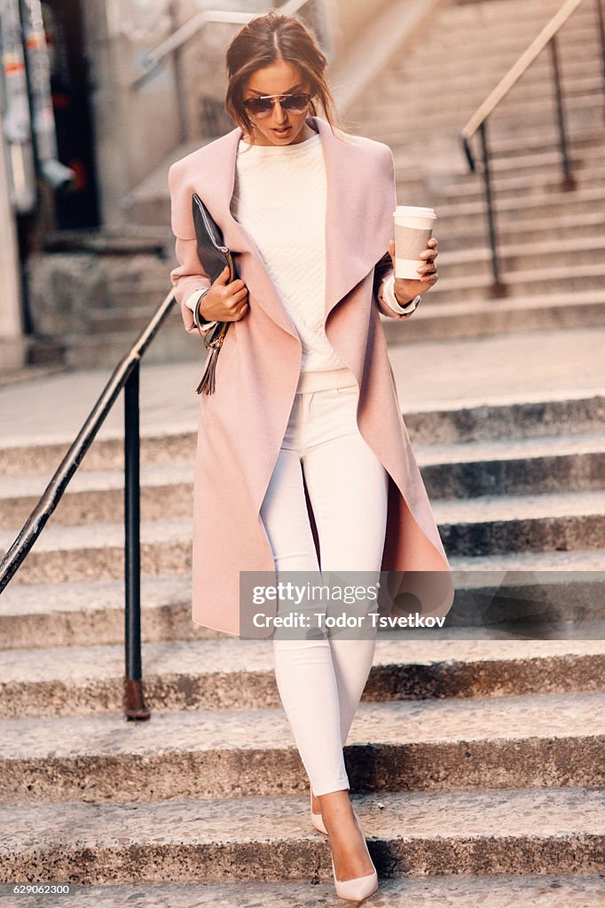 Beautiful elegant woman drinking coffee