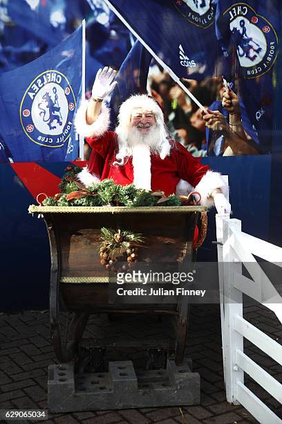 Father Christmas waves outside the stadium prior to the Premier League match between Chelsea and West Bromwich Albion at Stamford Bridge on December...