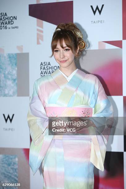 Japanese model Lena Fujii poses on the red carpet of Asia Fashion Award 2016 on December 10, 2016 in Taipei, Taiwan of China.