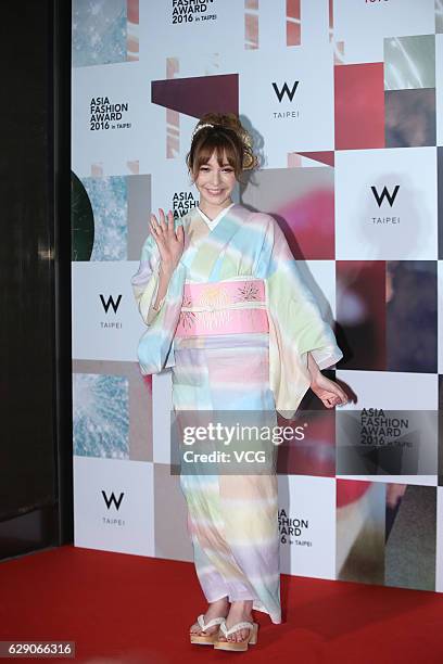 Japanese model Lena Fujii poses on the red carpet of Asia Fashion Award 2016 on December 10, 2016 in Taipei, Taiwan of China.