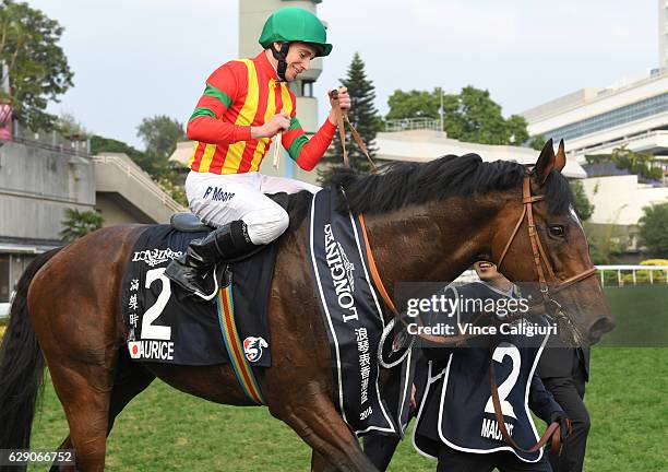 Ryan Moore riding Maurice of Japan after winning Race 8 the Longines Hong Kong Cup during Hong Kong International Racing at Sha Tin Racecourse on...