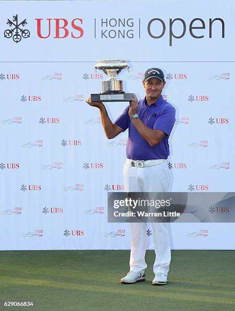 Sam Brazel of Australia poses with the trophy after winning the UBS Hong Kong Open at The Hong Kong Golf Club on December 11, 2016 in Hong Kong, Hong...