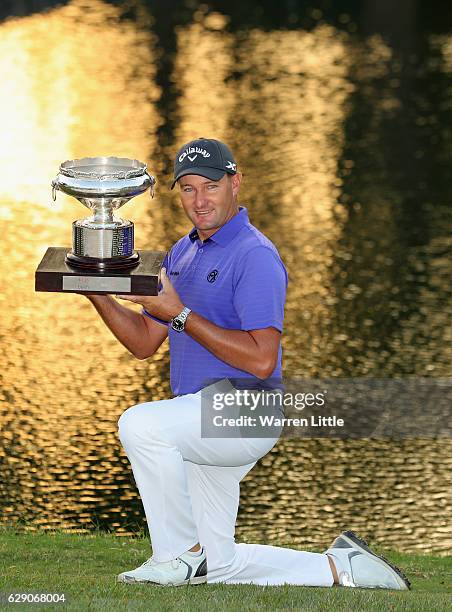 Sam Brazel of Australia poses with the trophy after winning the UBS Hong Kong Open at The Hong Kong Golf Club on December 11, 2016 in Hong Kong, Hong...