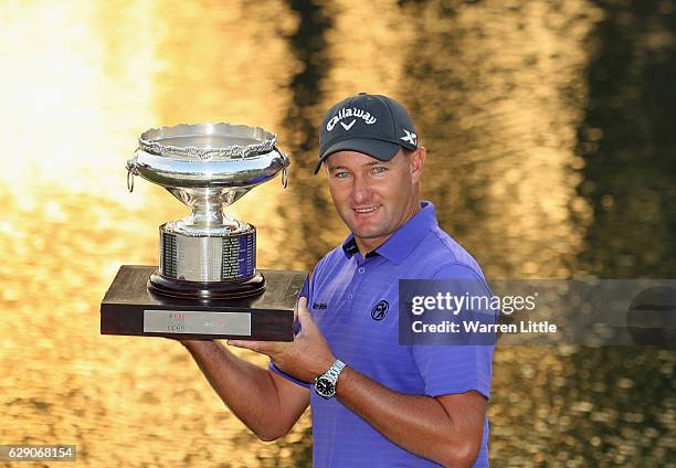 Sam Brazel of Australia poses with the trophy after winning the UBS Hong Kong Open at The Hong Kong Golf Club on December 11, 2016 in Hong Kong, Hong...