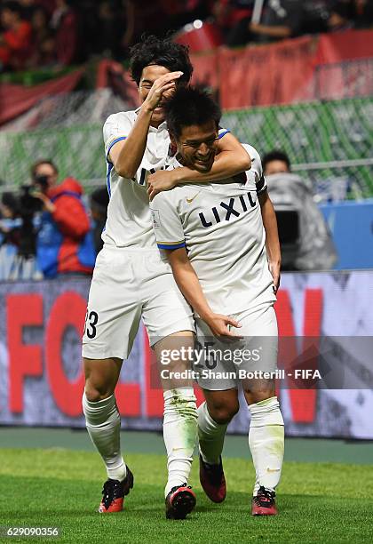 Yasushi Endo of Kashima Antlers celebrates scoring the opening goal during the FIFA Club World Cup second round match between Mamelodi Sundowns and...