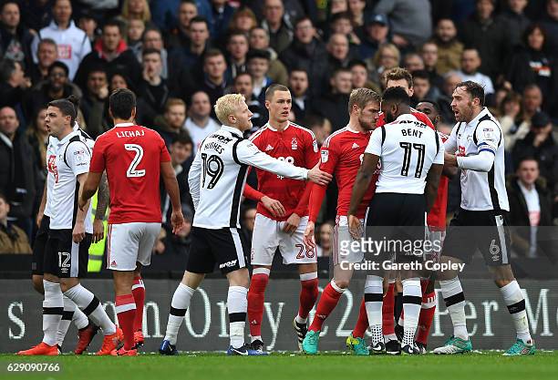 Damien Perquis of Nottingham Forest and Darren Bent of Derby County clash during the Sky Bet Championship match between Derby County and Nottingham...