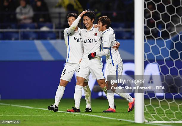 Mu Kanazaki of Kashima Antlers celebrates scoring his team's second goal with team mates during the FIFA Club World Cup second round match between...