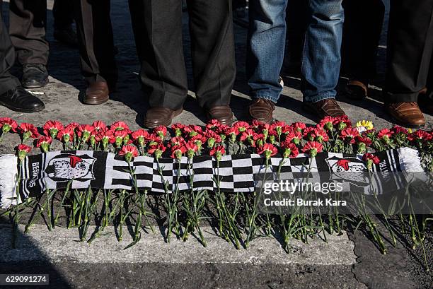 People leave red carnations as they visit the scene of Saturday's blasts in Istanbul, December 11, 2016 Turkey. According to Interior Minister...