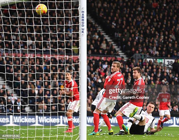 Nicklas Bendtner of Nottingham Forest scores an own goal for Derby County's first during the Sky Bet Championship match between Derby County and...