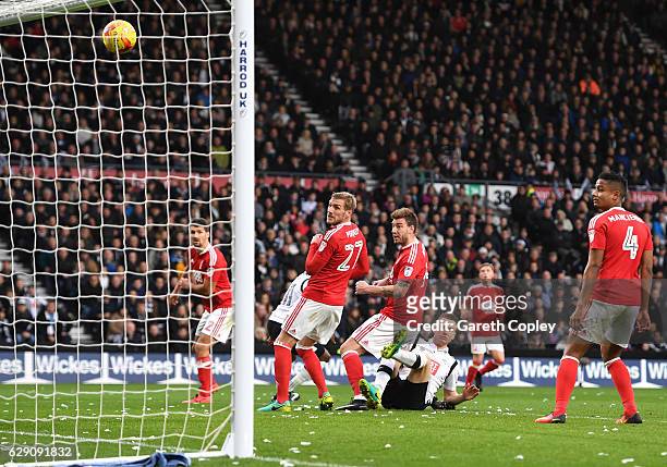 Nicklas Bendtner of Nottingham Forest scores an own goal for Derby County's first during the Sky Bet Championship match between Derby County and...