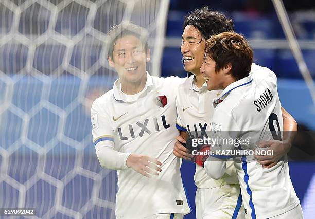 Kashima Antlers midfielder Mu Kanazaki celebrates his goal with teammates during the Club World Cup football match between Kashima Antlers and...