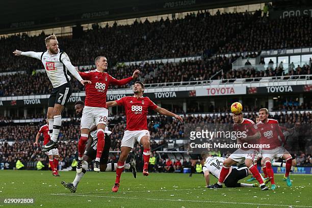 Nicklas Bendtner , number 14 of Nottingham Forest heads past his own goalkeeper to open the scoring for Derby County during the Sky Bet Championship...