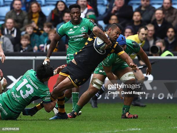 Kurtley Beale of Wasps dives over for the first try on his Wasps's debut during the European Champions Cup match between Wasps and Connacht at the...