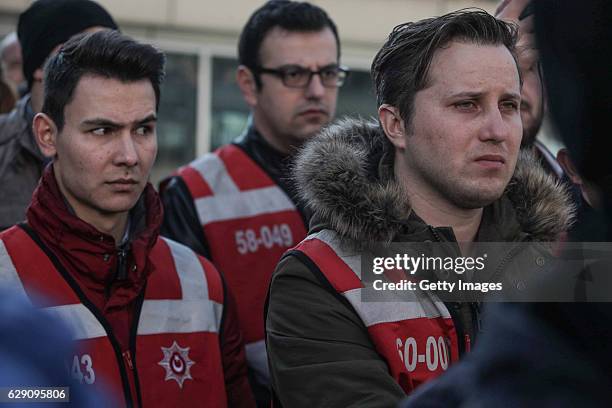 Plain clothes police officers mourn the police officers killed in yesterday's blast on December 11, 2016 in Istanbul, Turkey. According to Interior...