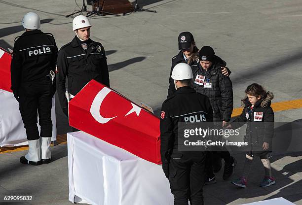 Relatives mourn the police officers killed in yesterday's blast on December 11, 2016 in Istanbul, Turkey. According to Interior Minister Suleyman...